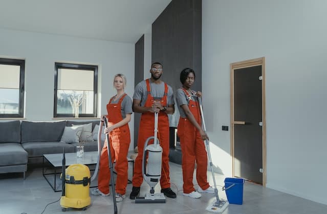 Three pro cleaners in uniforms